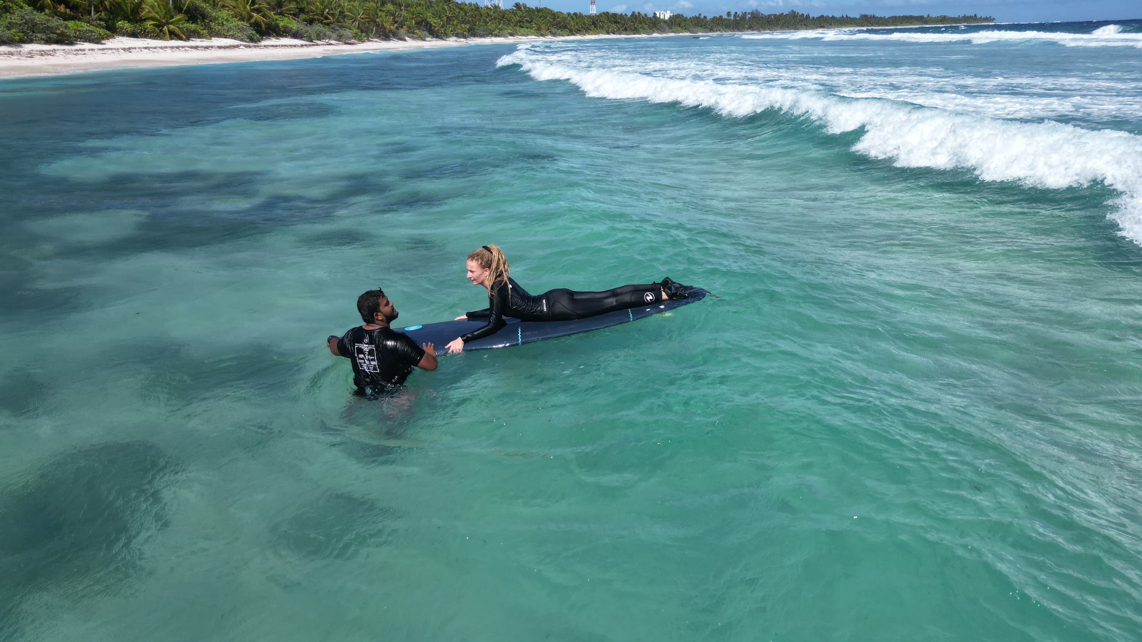 Student practicing surf techniques